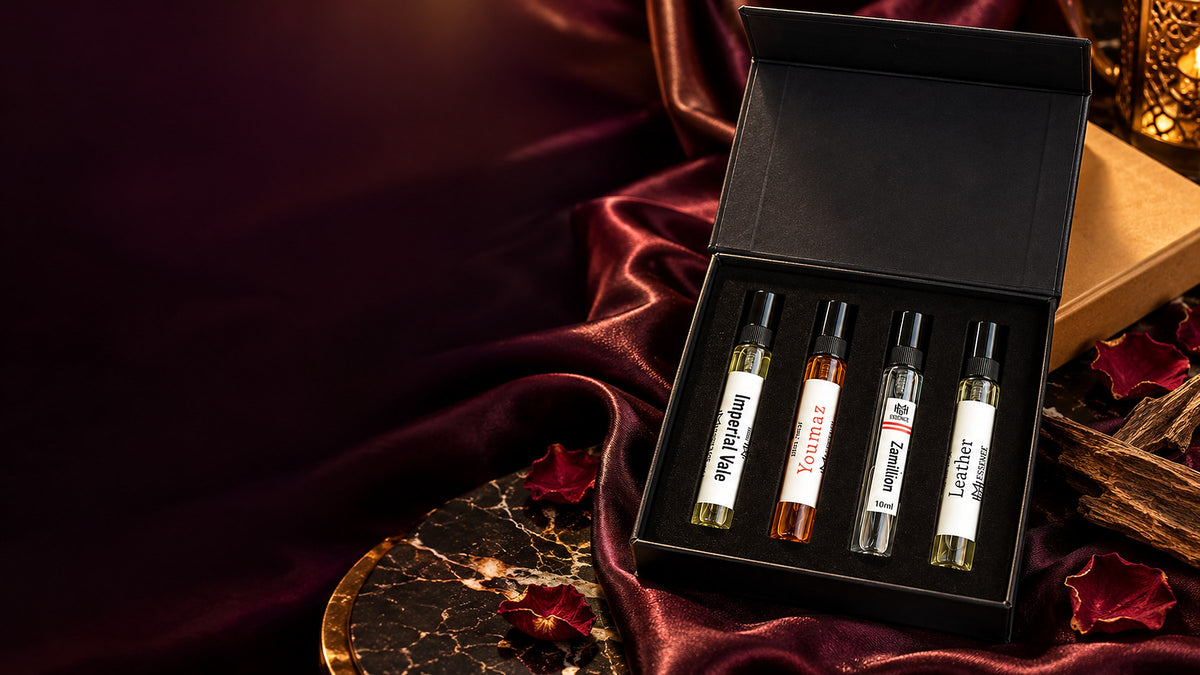 MHB Essence Discovery Kit — four 10ml Extrait de Parfum (Imperial, Youmaz, Zamillion, Leather) in the black gift box on burgundy satin